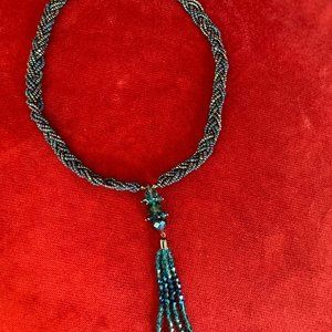 AB small beads blue purple and green peacock colors braided a AB crystal pendant